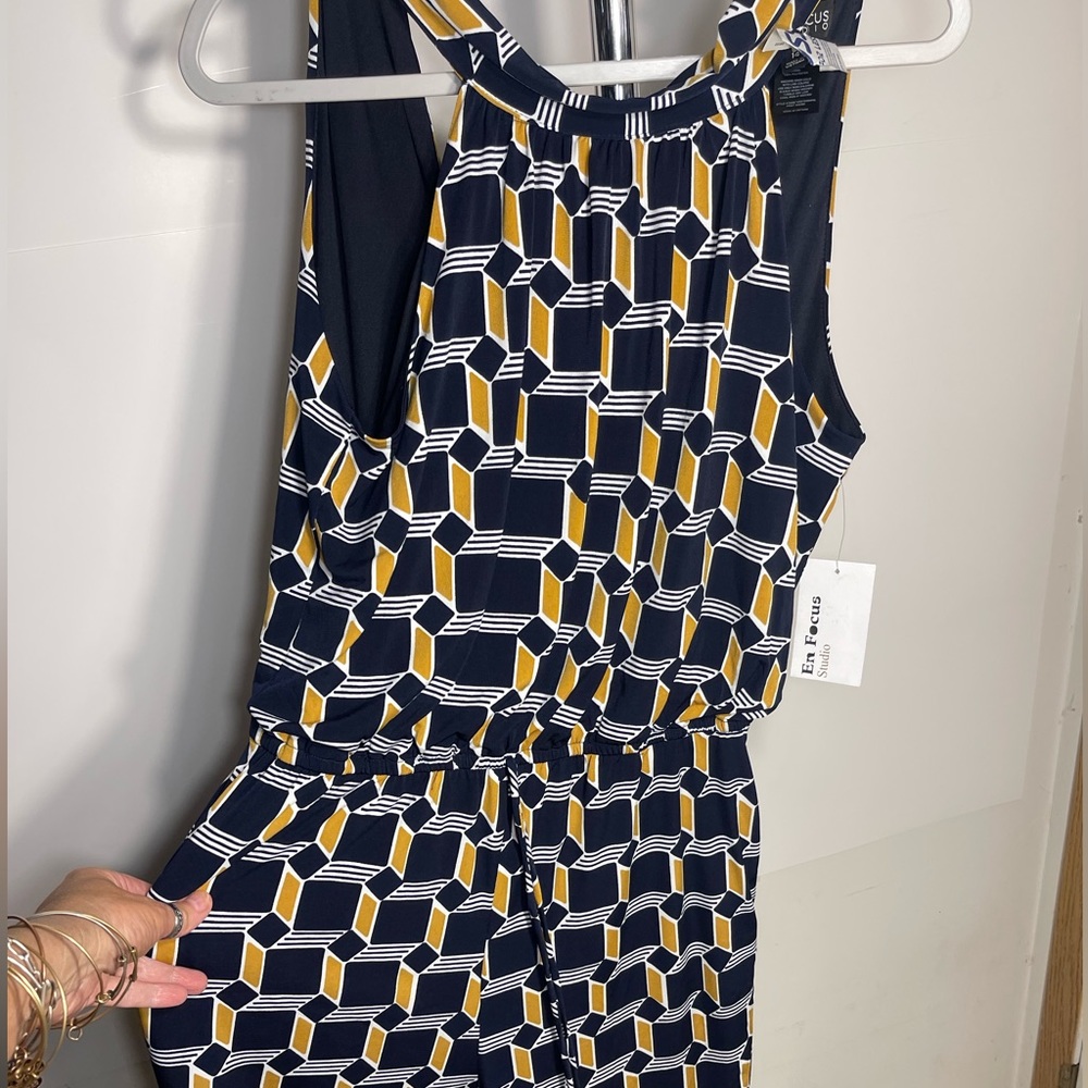 This is a jumpsuit called Enfocus Studio size 14 Blue / Gold and white in color